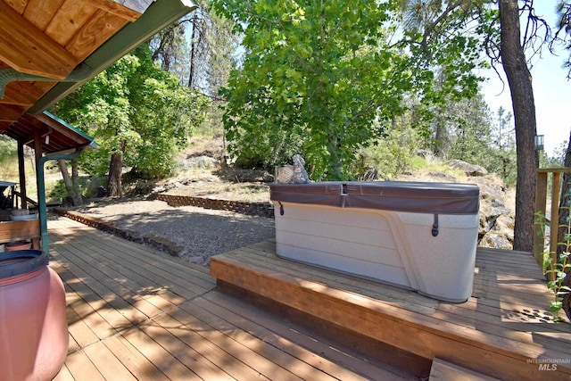 deck with a hot tub