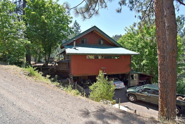 view of home's exterior with a wooden deck