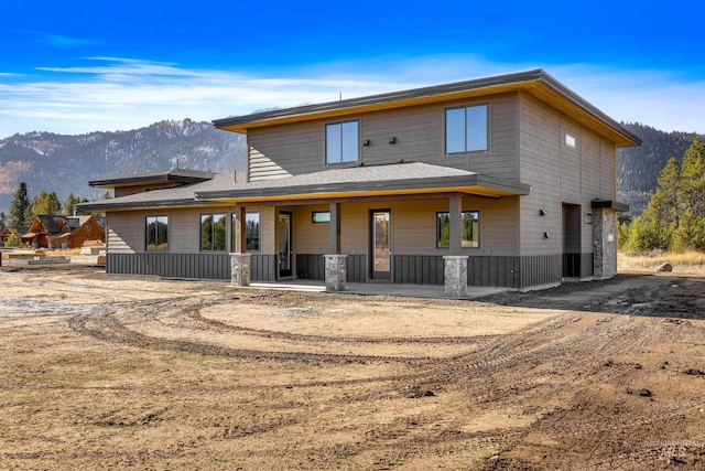 13156 Hawks Bay, Donnelly, ID 83615 - view of front facade with a mountain view and a porch