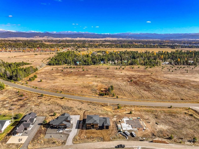 13156 Hawks Bay, Donnelly, ID 83615 - aerial overview of property's location featuring a mountain backdrop and rural landscape