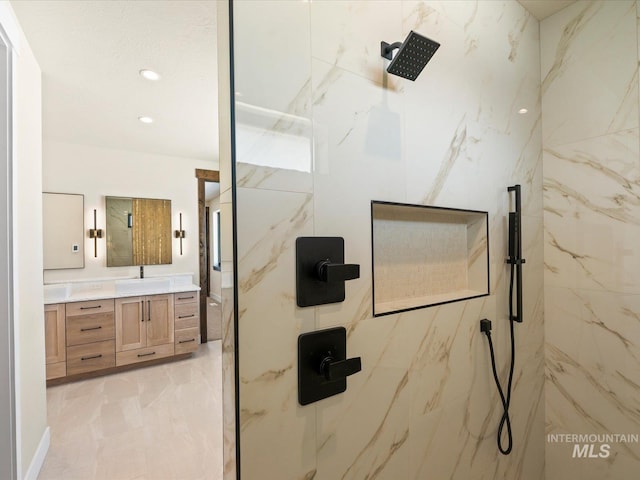 13156 Hawks Bay, Donnelly, ID 83615 - bathroom featuring vanity, a marble finish shower, marble finish floors, and recessed lighting