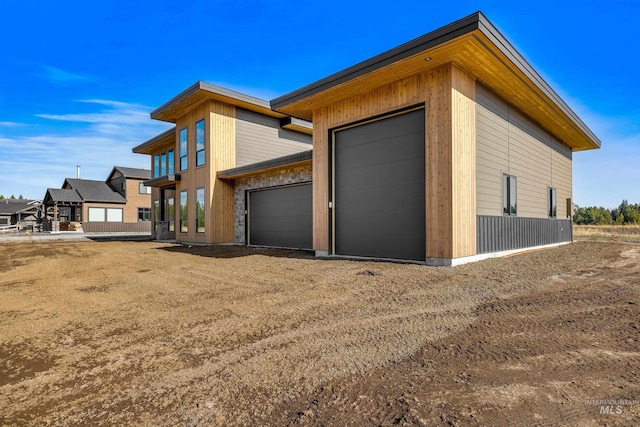 13156 Hawks Bay, Donnelly, ID 83615 - view of home's exterior featuring a garage and driveway
