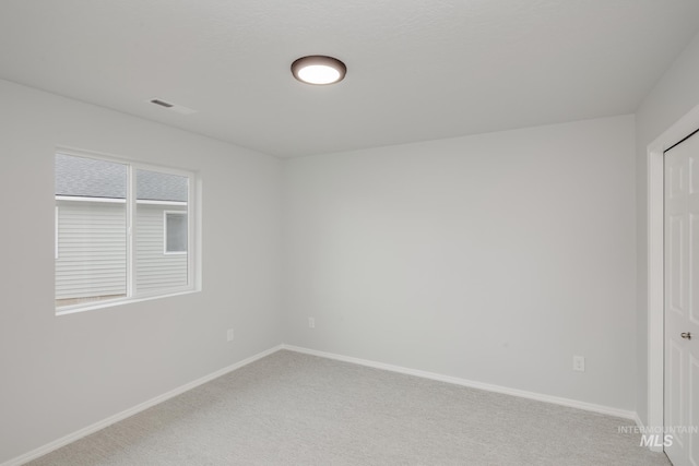 empty room featuring carpet floors