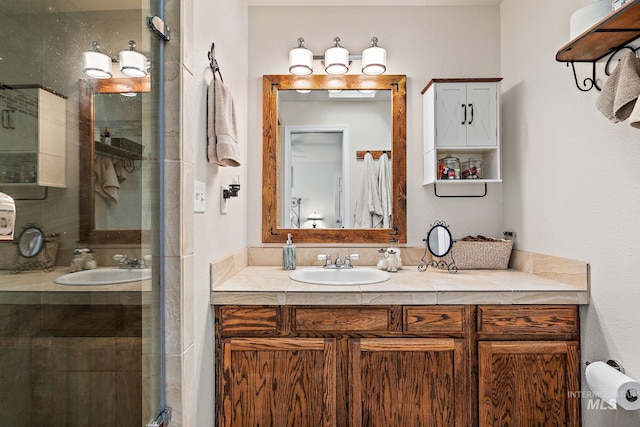 bathroom with vanity and a shower stall