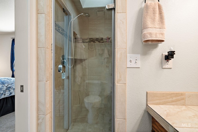 full bath with a shower stall, ensuite bath, and toilet