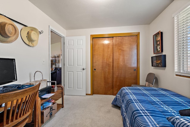 carpeted bedroom featuring a closet