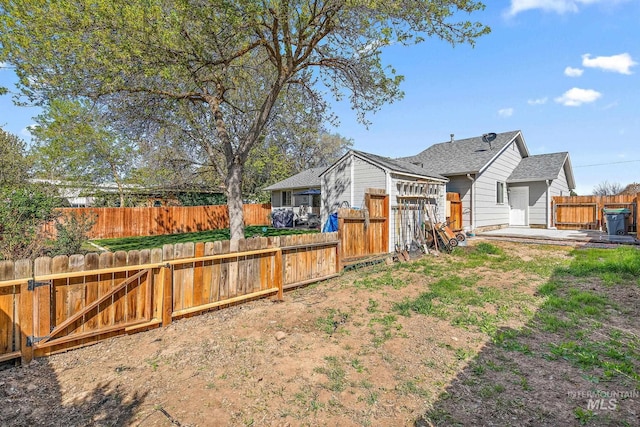 back of house featuring a fenced backyard