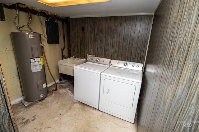 clothes washing area featuring a sink, electric panel, electric water heater, laundry area, and washing machine and clothes dryer