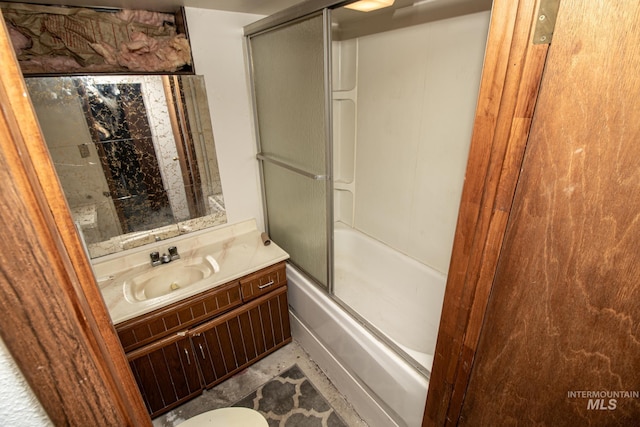 full bathroom featuring bath / shower combo with glass door and vanity