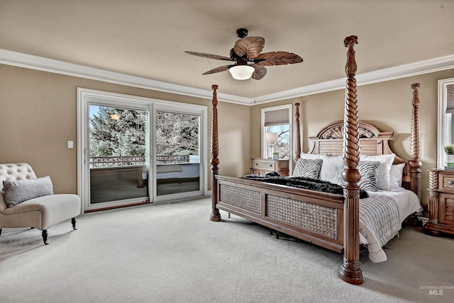 carpeted bedroom featuring access to outside, a ceiling fan, and crown molding