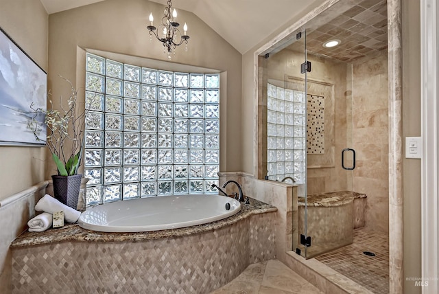 bathroom featuring vaulted ceiling, a notable chandelier, a garden tub, and a shower stall