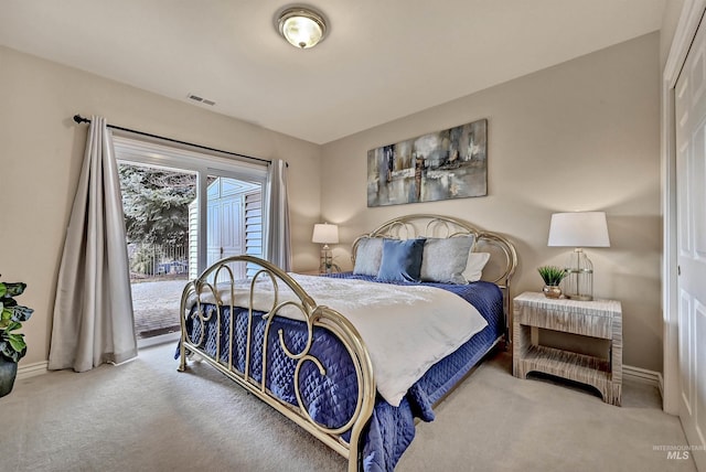 carpeted bedroom with baseboards