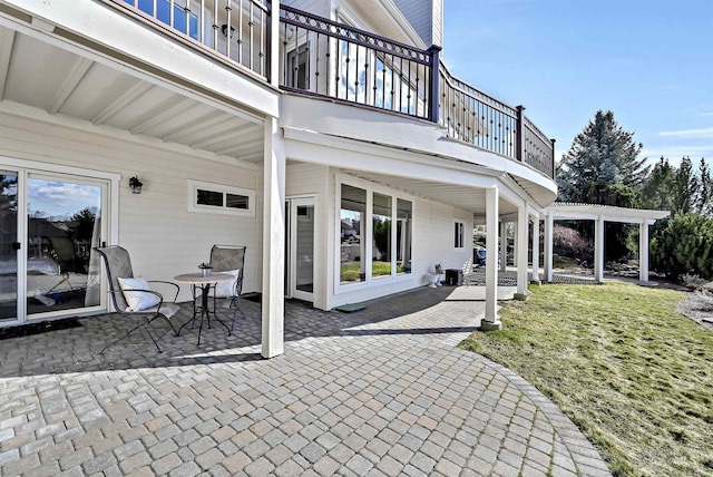 view of patio with a balcony and a pergola