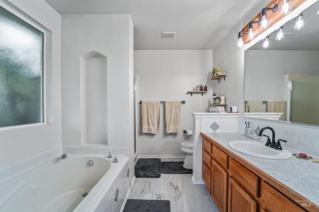 8116 Waterleaf Ave, Nampa, ID 83687 - full bath featuring vanity, toilet, a bath, a shower stall, and marble look tiles