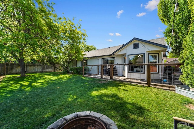 8116 Waterleaf Ave, Nampa, ID 83687 - rear view of property with an outdoor fire pit