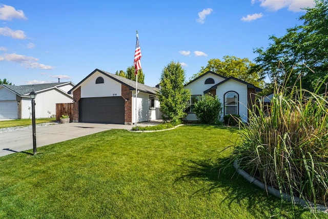8116 Waterleaf Ave, Nampa, ID 83687 - single story home with an attached garage, concrete driveway, a front yard, and brick siding
