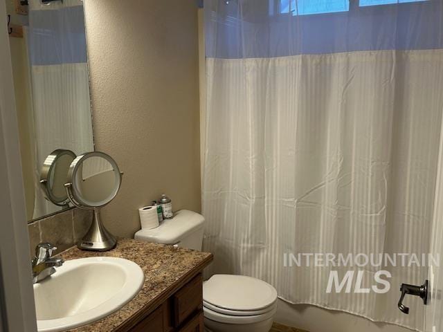 bathroom with vanity and toilet