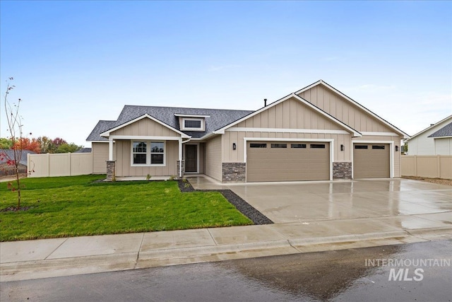 view of front facade with a garage and a front lawn