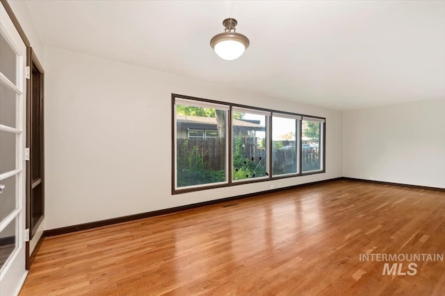 6917 W Randolph Dr, Boise, ID 83709 - unfurnished room with healthy amount of natural light, light wood-type flooring, and baseboards
