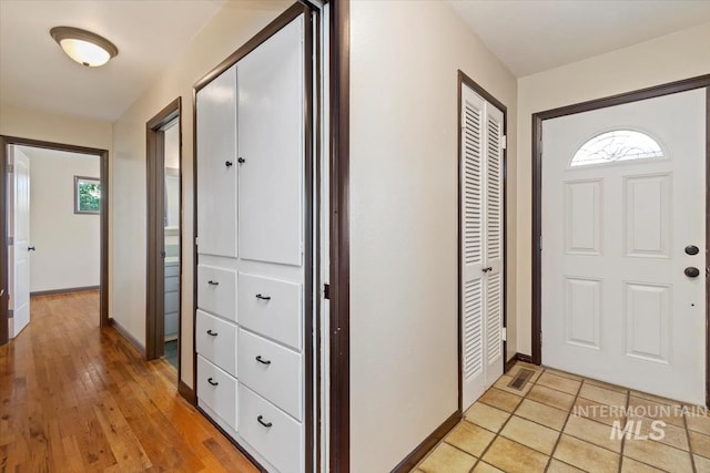 6917 W Randolph Dr, Boise, ID 83709 - foyer entrance featuring baseboards, healthy amount of natural light, and light wood finished floors