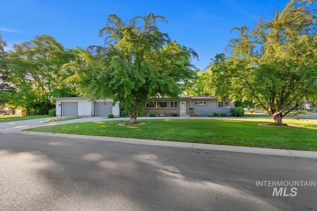 6917 W Randolph Dr, Boise, ID 83709 - ranch-style house with a front lawn, a garage, and driveway
