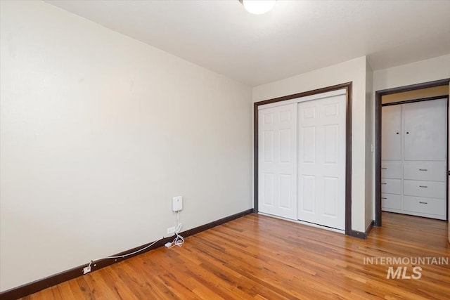 6917 W Randolph Dr, Boise, ID 83709 - unfurnished bedroom with baseboards, light wood finished floors, and a closet