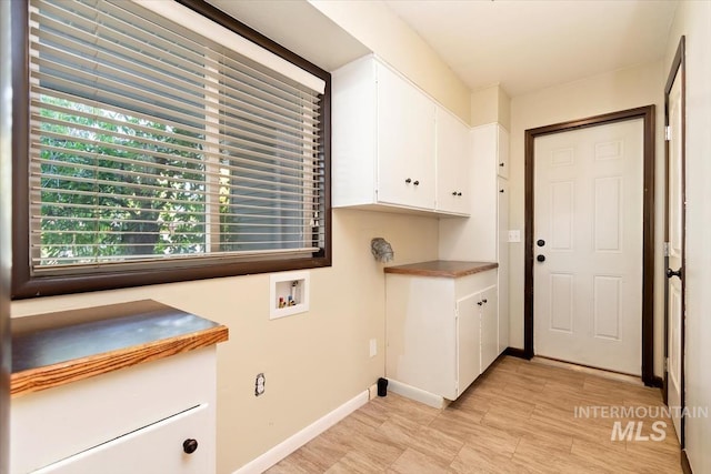 6917 W Randolph Dr, Boise, ID 83709 - washroom with cabinet space, hookup for a washing machine, and baseboards