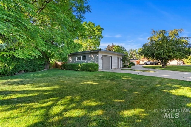 6917 W Randolph Dr, Boise, ID 83709 - view of front of home with concrete driveway, a front lawn, and an attached garage