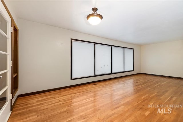 6917 W Randolph Dr, Boise, ID 83709 - spare room with baseboards and light wood-style floors