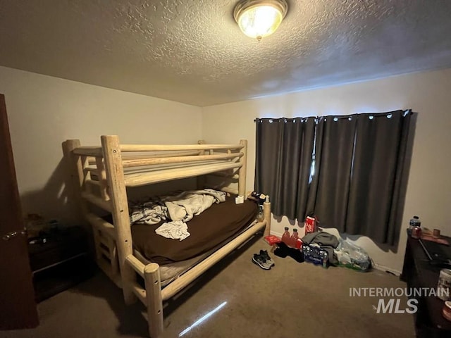 329 Forest St, Mccall, ID 83638 - carpeted bedroom with a textured ceiling