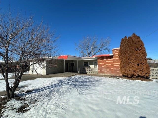 view of snow covered property