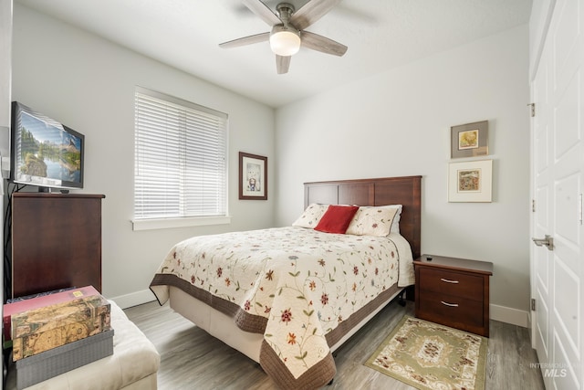 421 S Curtis Unit 128, Boise, ID 83705 - bedroom featuring baseboards, a ceiling fan, and wood finished floors