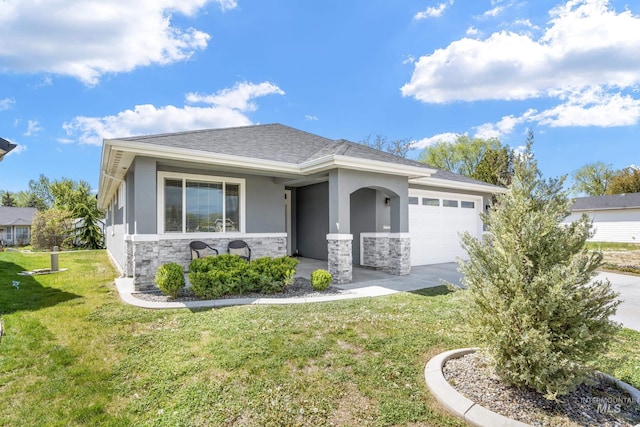421 S Curtis Unit 128, Boise, ID 83705 - view of front of property featuring stone siding, a garage, stucco siding, a front yard, and concrete driveway