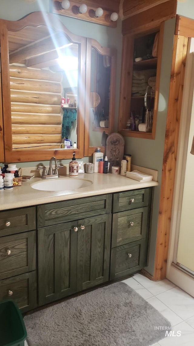 bathroom featuring tile patterned flooring and vanity