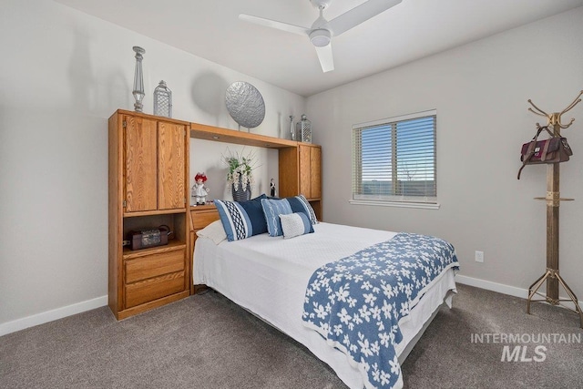 bedroom with ceiling fan and dark colored carpet