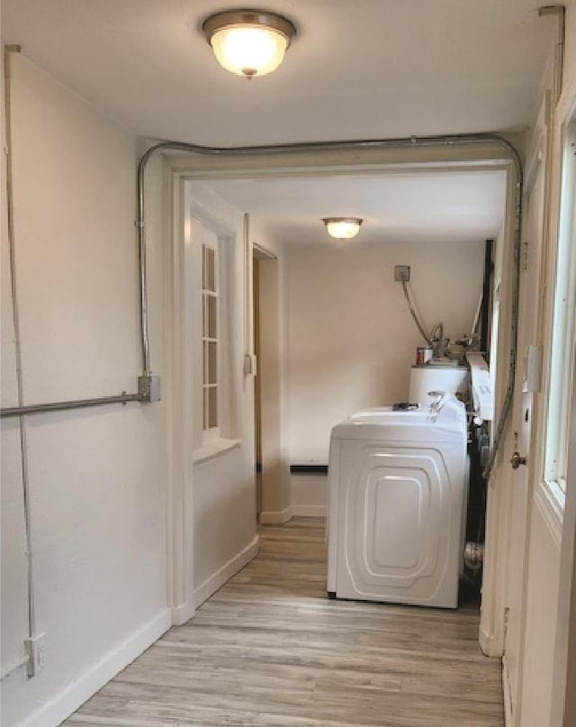 3377 W Nez Perce St, Boise, ID 83705 - clothes washing area featuring light wood finished floors, baseboards, and washer / dryer