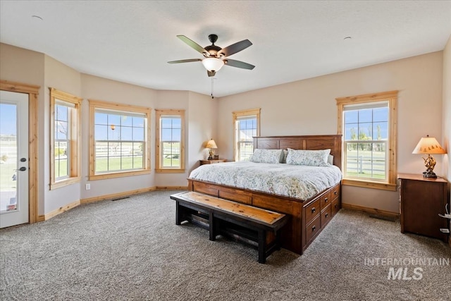 bedroom with carpet floors, a ceiling fan, baseboards, and visible vents