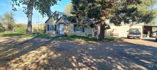 view of front of property featuring a carport