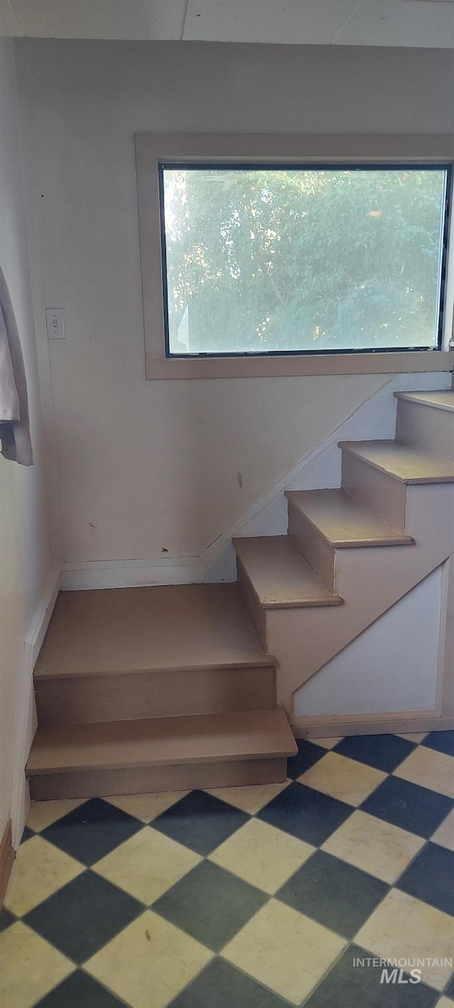 staircase featuring a healthy amount of sunlight