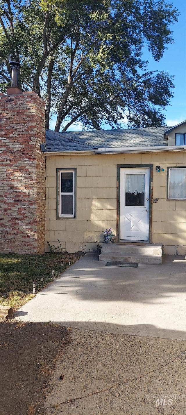 entrance to property featuring a patio