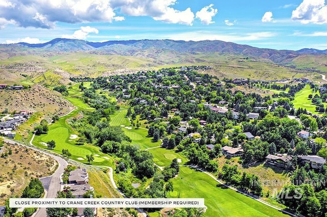 birds eye view of property featuring a mountain view and golf course view