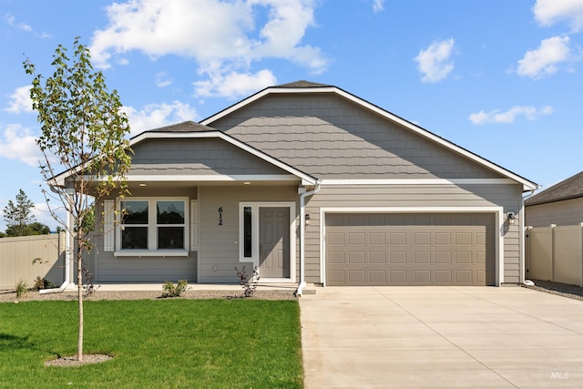 view of front facade featuring a front lawn and a garage