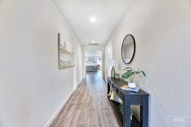 corridor featuring hardwood / wood-style floors