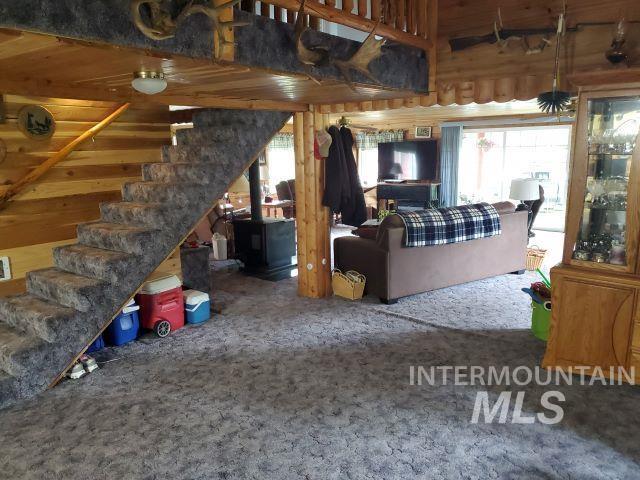3460 American River Rd, Elk City, ID 83525 - carpeted living area featuring stairs