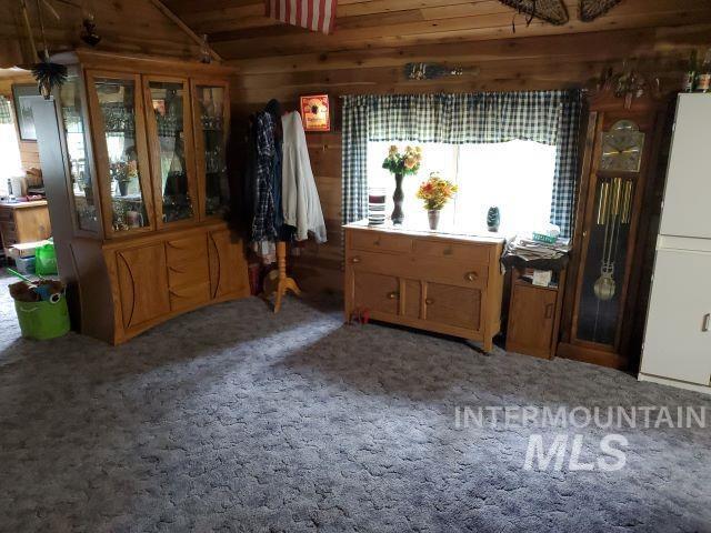 3460 American River Rd, Elk City, ID 83525 - interior space featuring lofted ceiling, wooden walls, and wooden ceiling