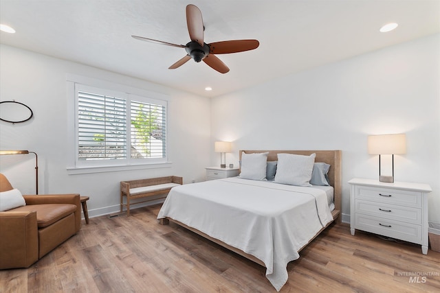 6009 W Riva Capri St, Meridian, ID 83646 - bedroom featuring baseboards, light wood finished floors, and recessed lighting