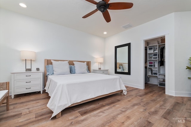 6009 W Riva Capri St, Meridian, ID 83646 - bedroom featuring a spacious closet, light wood-style floors, visible vents, and recessed lighting