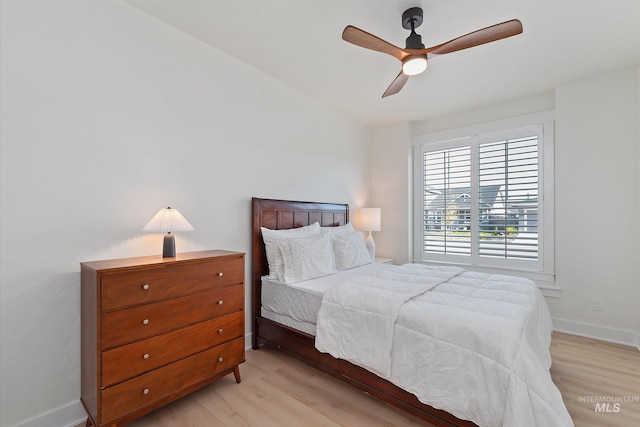 6009 W Riva Capri St, Meridian, ID 83646 - bedroom featuring ceiling fan, baseboards, and light wood-style floors