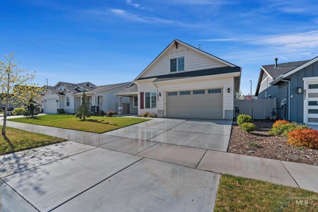6009 W Riva Capri St, Meridian, ID 83646 - ranch-style house featuring concrete driveway, a gate, fence, and a front yard