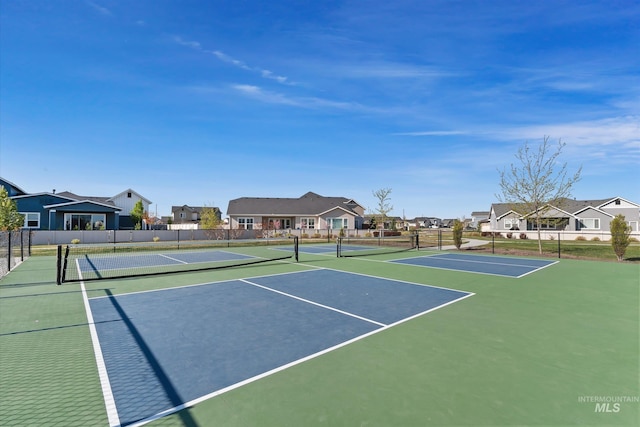 6009 W Riva Capri St, Meridian, ID 83646 - view of tennis court featuring a residential view, community basketball court, and fence